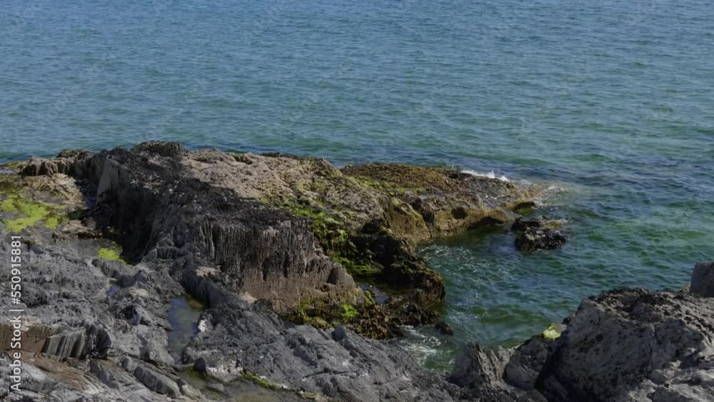 Sea water splashes against the coastal rocks. Seascape. Sea water splashes against the coastal rocks. Seascape.
