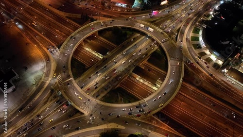 Aerial drone night video of illuminated ring road in Kifisias and Attiki odos avenues, a popular multilevel junction circular road, Attica, Greece photo