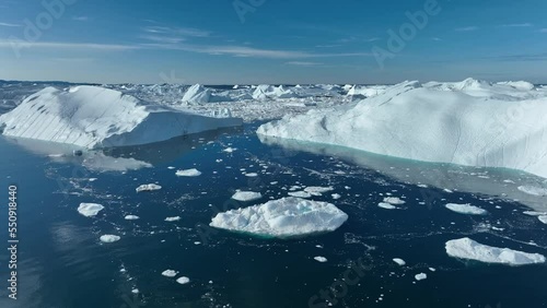 crossing big icebergs from aerial view photo