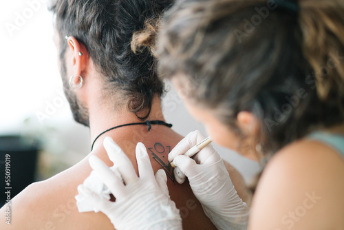 Detail of Handpoke tattoo technique minimalist design