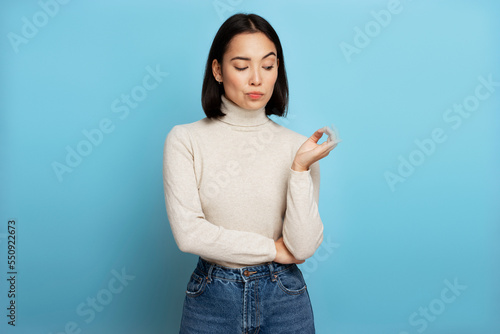Fotografia Portrait of thoughtful girl pondering serious issues, looking with uncertain hes