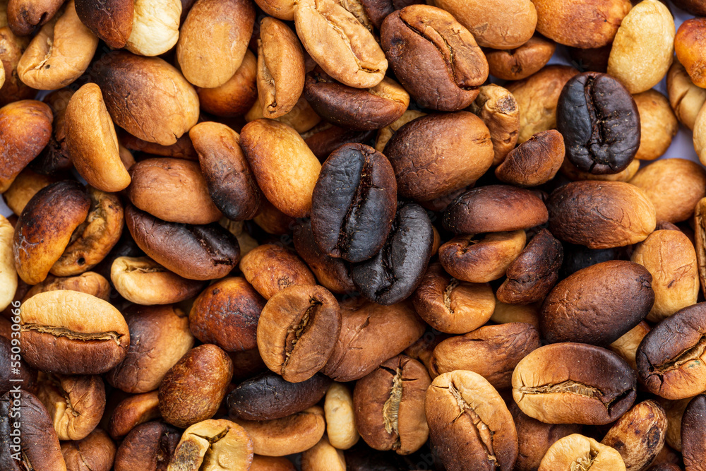 Macro coffee beans background,Roasted coffee beans can be used as a background. Macro coffee beans background,Roasted coffee beans can be used as a background.