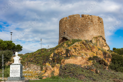 Old Spanish turret, torre spagnola, torre longosardo tower, in Santa Teresa Gallura, Sardinia. Corsica on the background. photo