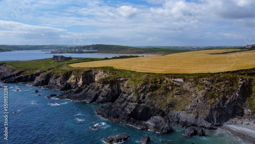 Beautiful farm fields on the hillsides of the Atlantic Ocean coast. Clonakilty Bay, top view. Seascape. Aerial photo.