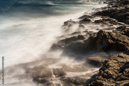 Flowing movements of the sea on the coast long exposure