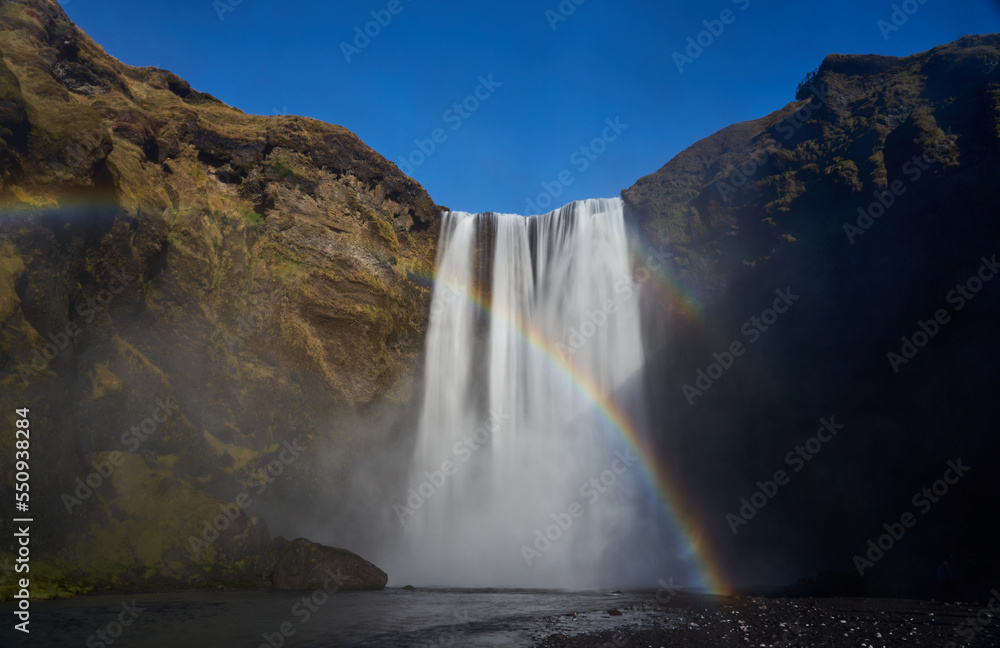 Skogafoss waterfall with rainbow