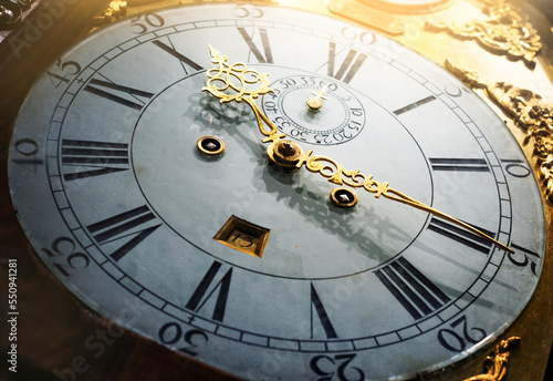 Close up old antique classic clock. Concept of time, history, science, memory, information. Retro style. Vintage watch, clock background.