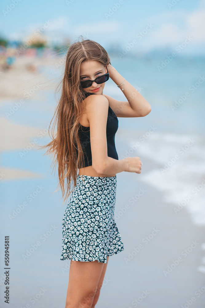 Happy young girl enjoy tropical beach vacation Happy young girl enjoy tropical beach vacation