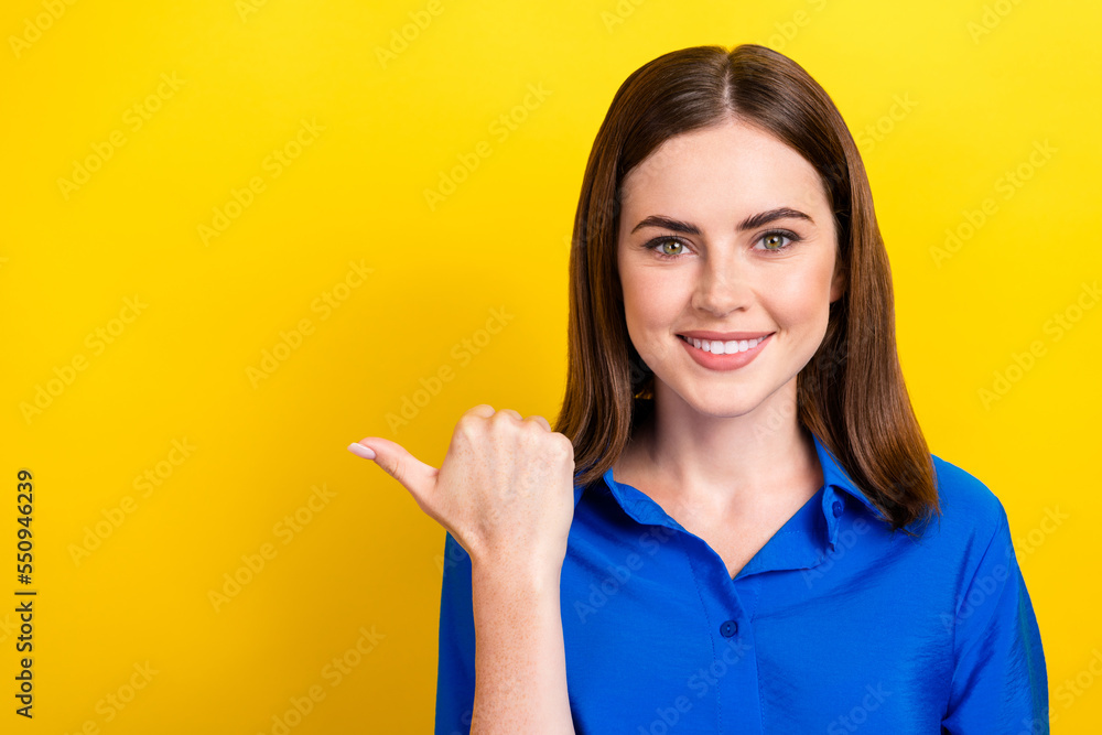 Photo of adorable lady wear trendy blue clothes arm demonstrate empty space cool good job stomatology isolated on yellow color background Photo of adorable lady wear trendy blue clothes arm demonstrate empty space cool good job stomatology isolated on yellow color background