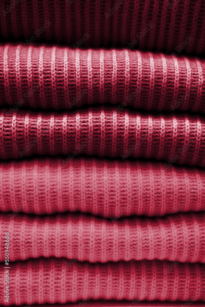 Handmade knitting wool texture background. New 2023 trending PANTONE Viva magenta colour Handmade knitting wool texture background. New 2023 trending PANTONE Viva magenta colour