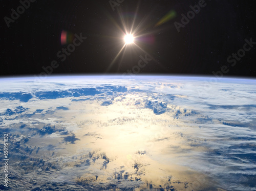 Earth and Sun. Elements of this image furnished by NASA.