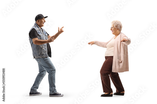 Full length profile shot of a mature man dancing with a senior lady
