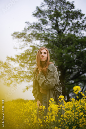 Girl in a yellow field in summer