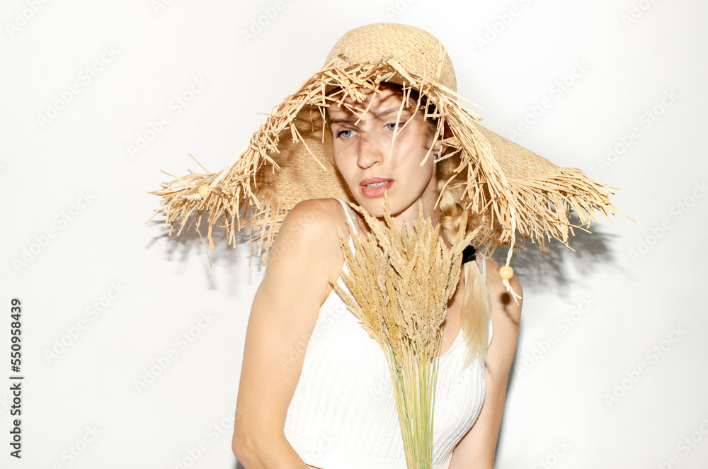 Portrait of young attarctive woman in straw hat Portrait of young attarctive woman in straw hat