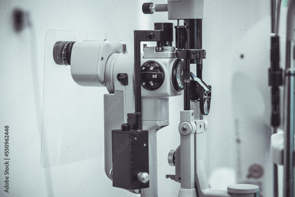 Different devices for measuring diopter and eye examination. Visit at the ophtalmologist, eye doctor, with all devices and appliances. Laser surgery.