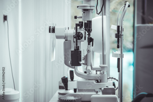 Obraz na płótnie Different devices for measuring diopter and eye examination. Visit at the ophtalmologist, eye doctor, with all devices and appliances. Laser surgery. w salonie