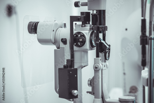 Different devices for measuring diopter and eye examination. Visit at the ophtalmologist, eye doctor, with all devices and appliances. Laser surgery. photo