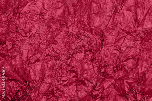 Trendy viva magenta color of the year 2023 background with uneven surface.