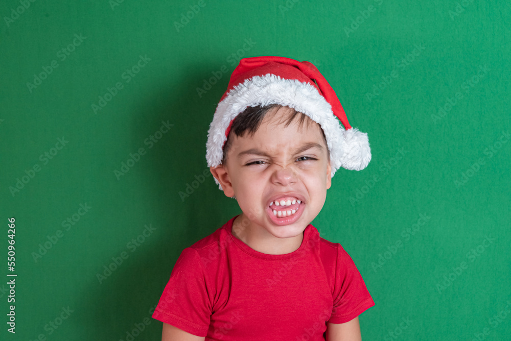 Happy and smiling boy with christmas hat Happy and smiling boy with christmas hat