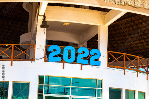 2022 sign on building at port harbor ferries Chiquilá Mexico. photo