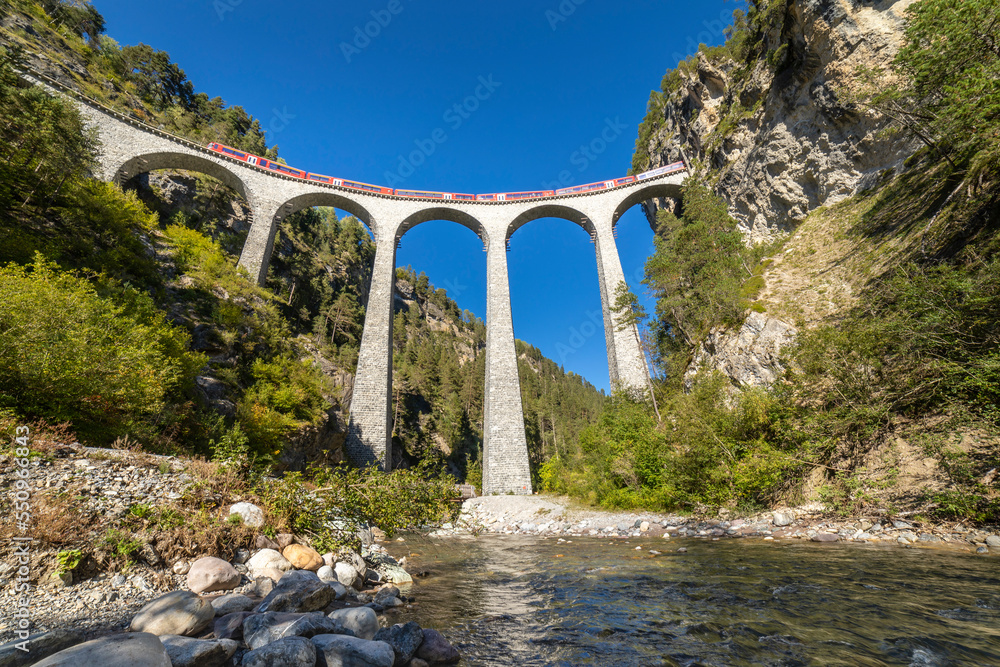 Swiss train over Landwasser Viaduct bridge in the alps, Graubunden, Switzerland
