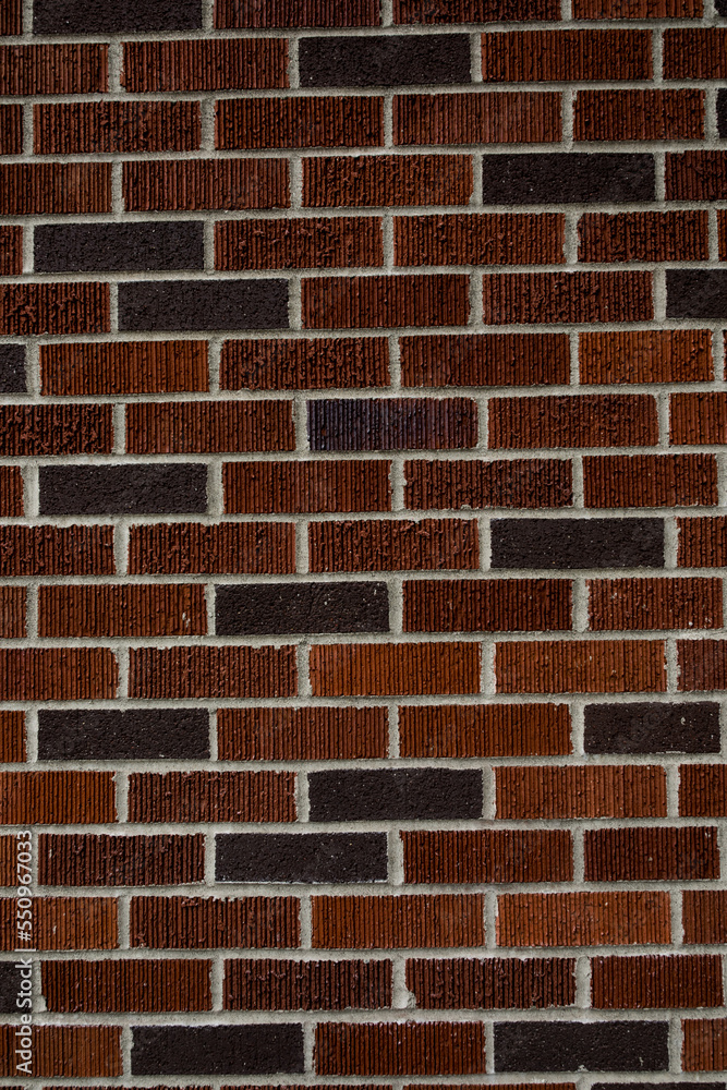 newly built red and purple brick wall with white grout newly built red and purple brick wall with white grout