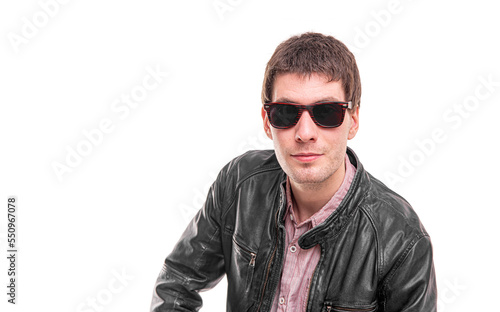 Attractive man in dark sunglasses isolated on white background.
