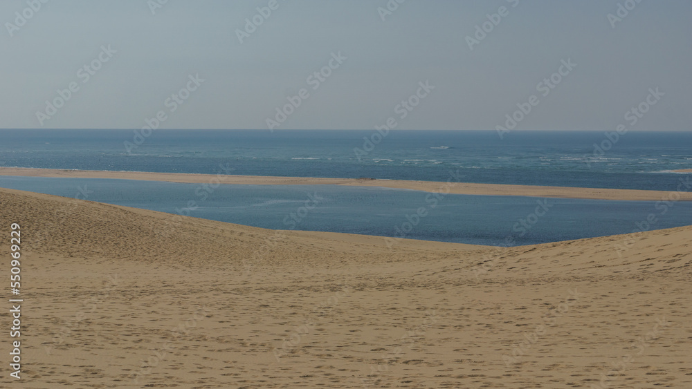 Atlantic sea and sand dune, Dune du Pilat, Arcachon, Nouvelle-Aquitaine, France Atlantic sea and sand dune, Dune du Pilat, Arcachon, Nouvelle-Aquitaine, France