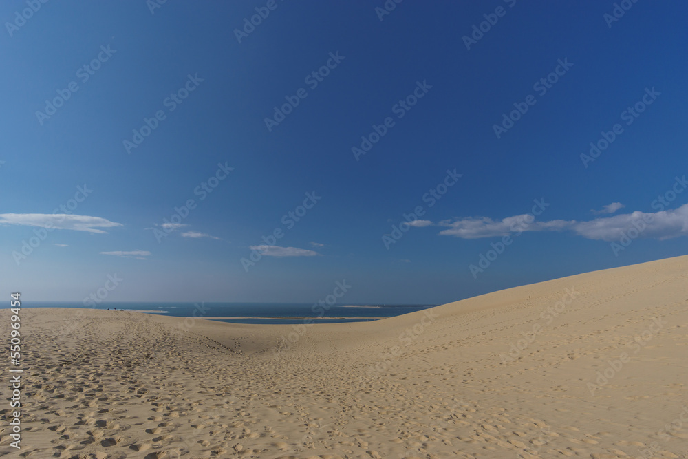 Sand dune, atlantic sea and blue cloudy sky, Dune du Pilat, Arcachon, Nouvelle-Aquitaine, France