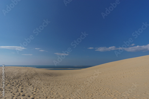 Sand dune, atlantic sea and blue cloudy sky, Dune du Pilat, Arcachon, Nouvelle-Aquitaine, France