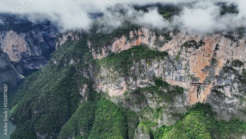 Aerial view of the majestic Canyon del Sumidero in Mexico. Flight over the canyon in the clouds.