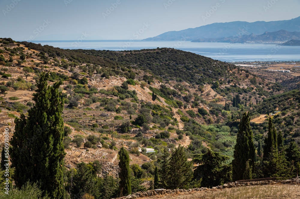 View of the hillsides extending to the Aegean Sea outside of the town of Lefkes, on the island of Paros.