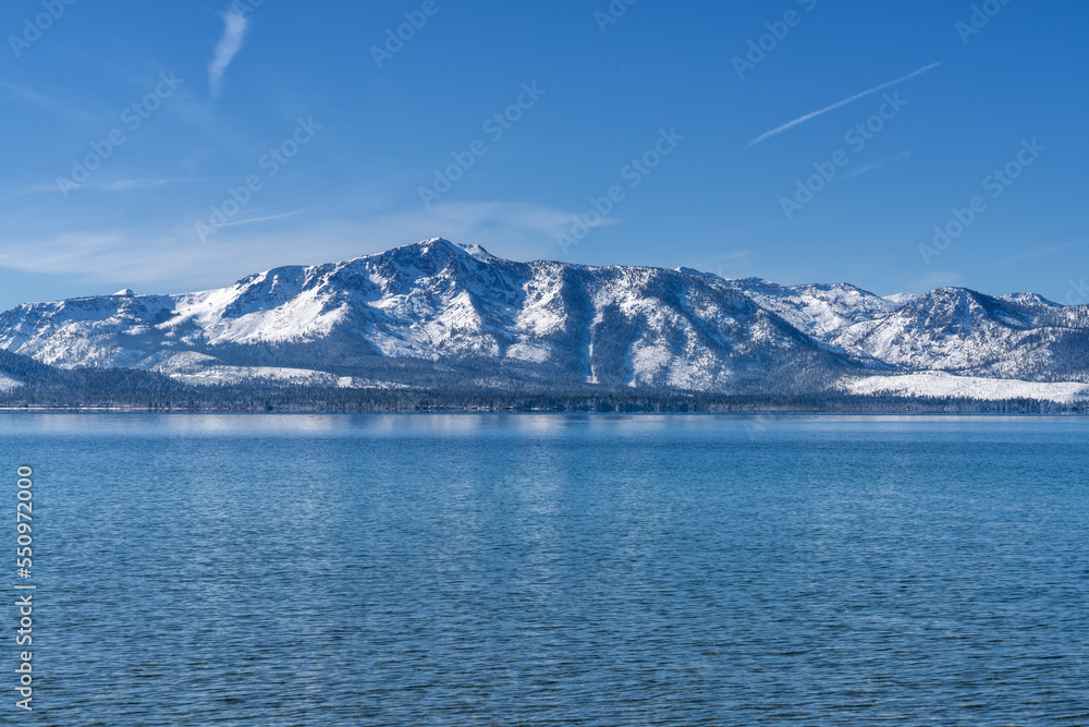 Snow Covered Desolation Wilderness Peaks and Lake Tahoe from Nevada Beach Snow Covered Desolation Wilderness Peaks and Lake Tahoe from Nevada Beach