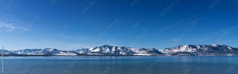 Snow Covered Desolation Wilderness Peaks and Lake Tahoe from Nevada Beach