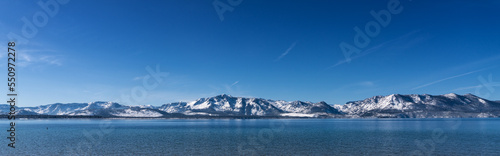 Snow Covered Desolation Wilderness Peaks and Lake Tahoe from Nevada Beach