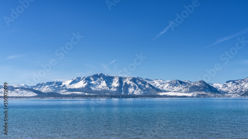 Snow Covered Peaks of Desolation Wilderness and Lake Tahoe from Nevada Beach