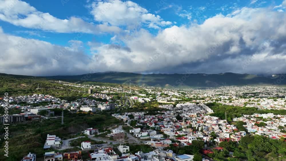 Aerial view of beautiful colorful rainbow over the mountains in city of Mexico, Tuxtla Gutierrez. Aerial view of beautiful colorful rainbow over the mountains in city of Mexico, Tuxtla Gutierrez.