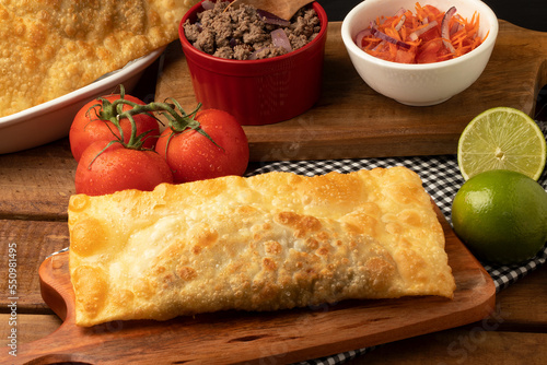 Typical snack pastel of meat and vinaigrette.