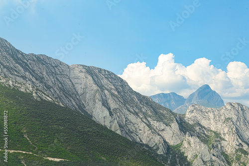 Majestic mountain landscape under blue sky with clouds