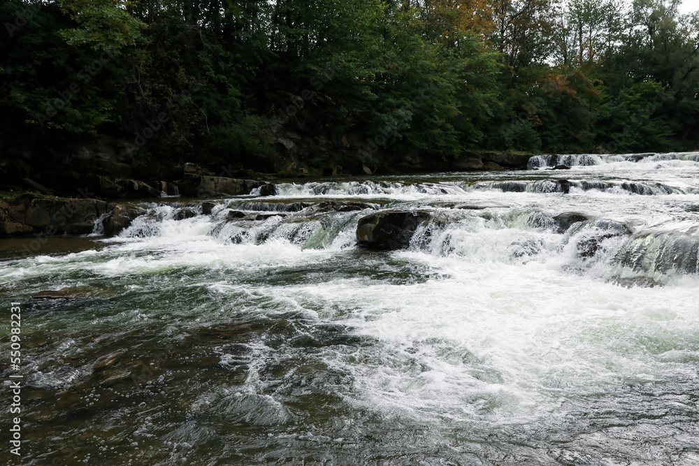 Picturesque view of beautiful river flowing near forest Picturesque view of beautiful river flowing near forest