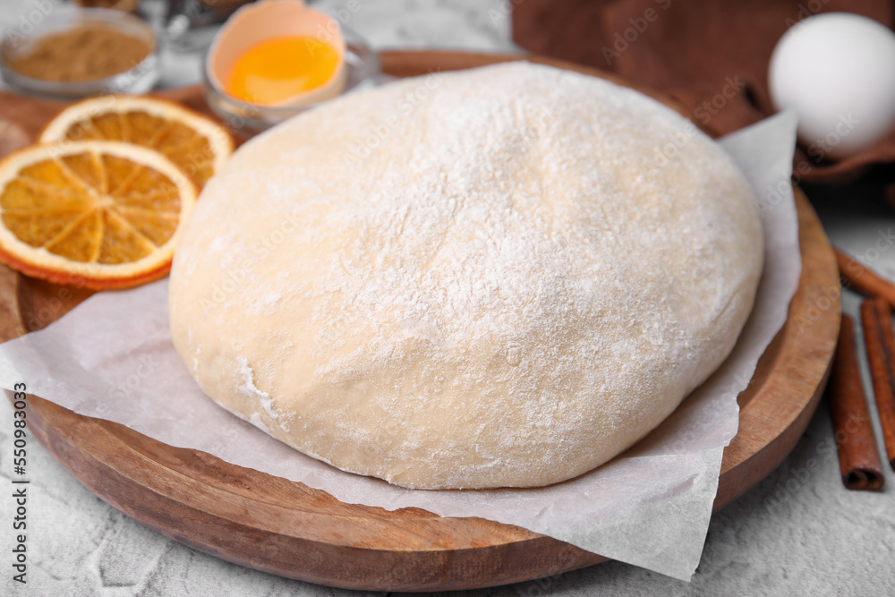 Fresh dough and ingredients on white table, closeup