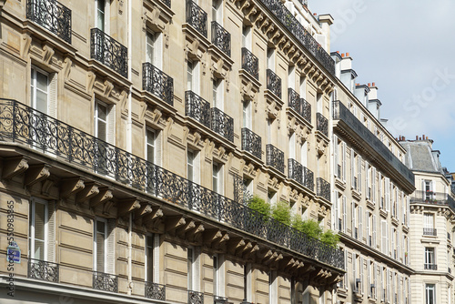 Paris, France - The facade of typical Parisian buildings, done in the typical elegant Haussmann (or Haussmannian) 19th-century style.