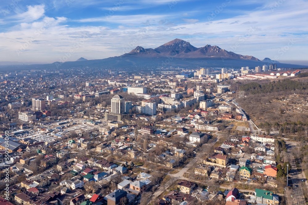 Aerial view of Pyatigorsk town and Mount Bestau on sunny winter day. Stavropol Krai, Russia. Aerial view of Pyatigorsk town and Mount Bestau on sunny winter day. Stavropol Krai, Russia.