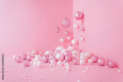Creative Abstract Festive composition with Christmas design pink pastel color background and pink and white balls Minimal concept of New Year's and Christmas Holidays. Flat lay.