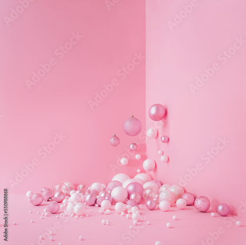 Creative Abstract Festive composition with Christmas design pink pastel color background and pink and white balls Minimal concept of New Year's and Christmas Holidays. Flat lay.