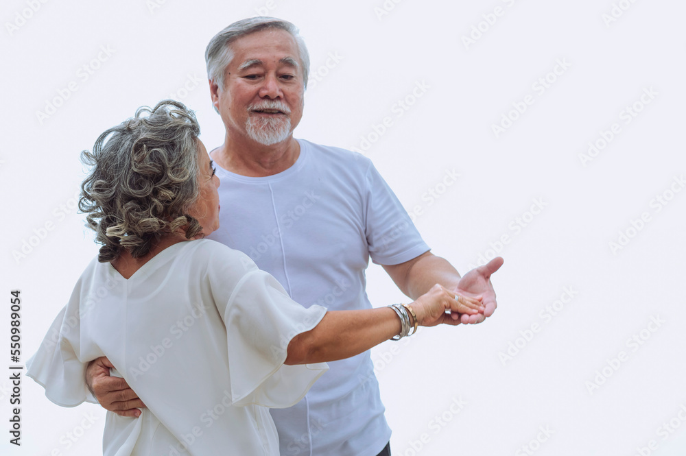 Happy asian senior retired couple, relax smiling elder man and woman enjoying with retired vacation at sea beach outdoor. Health care, Family outdoor lifestyle