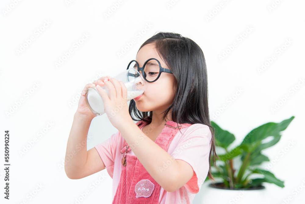 child asia girl drink milk with a glass child asia girl drink milk with a glass
