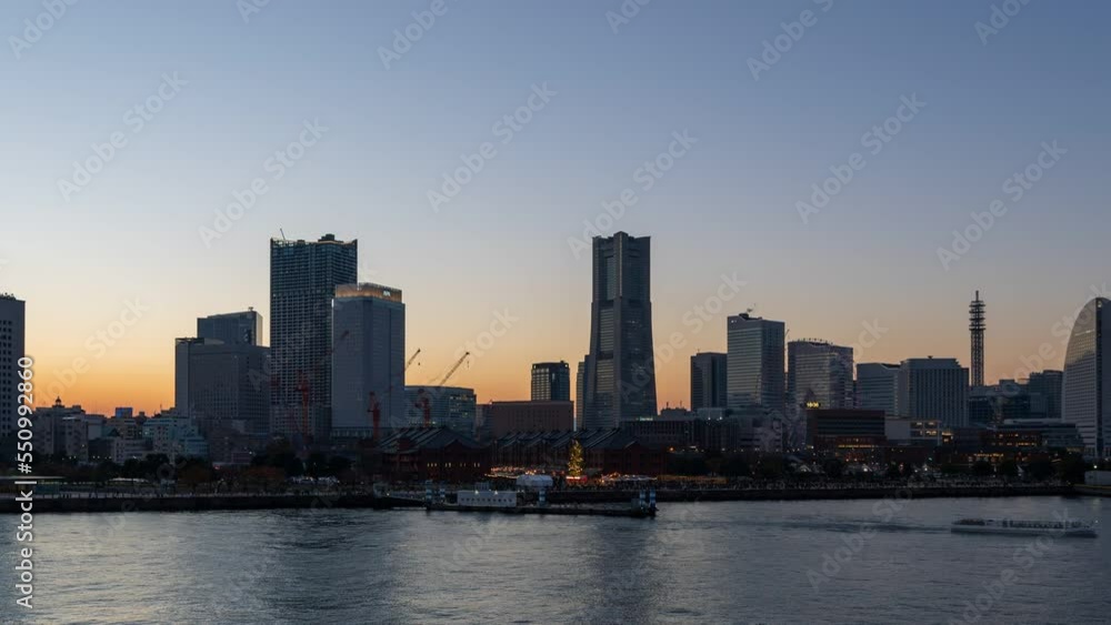 Dusk to night Timelapse video of Yokohama Minato Mirai 21 seaside urban area with Laser show. (Zoom out) Dusk to night Timelapse video of Yokohama Minato Mirai 21 seaside urban area with Laser show. (Zoom out)