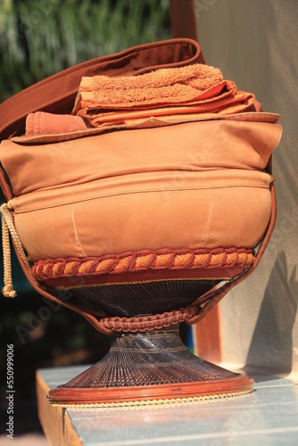 Monk's alms bowl: Put it on the table to offer food to monks at the funeral according to Thai tradition