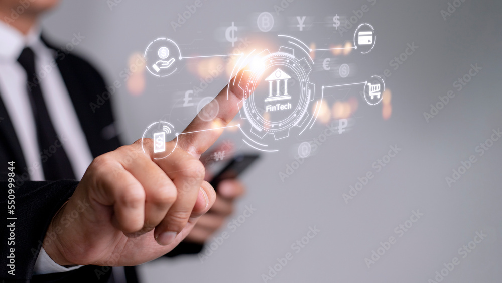 Future of financial technology concept businessman selecting fintech word Future of financial technology concept businessman selecting fintech word